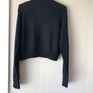 Women’s Black cropped sweater.